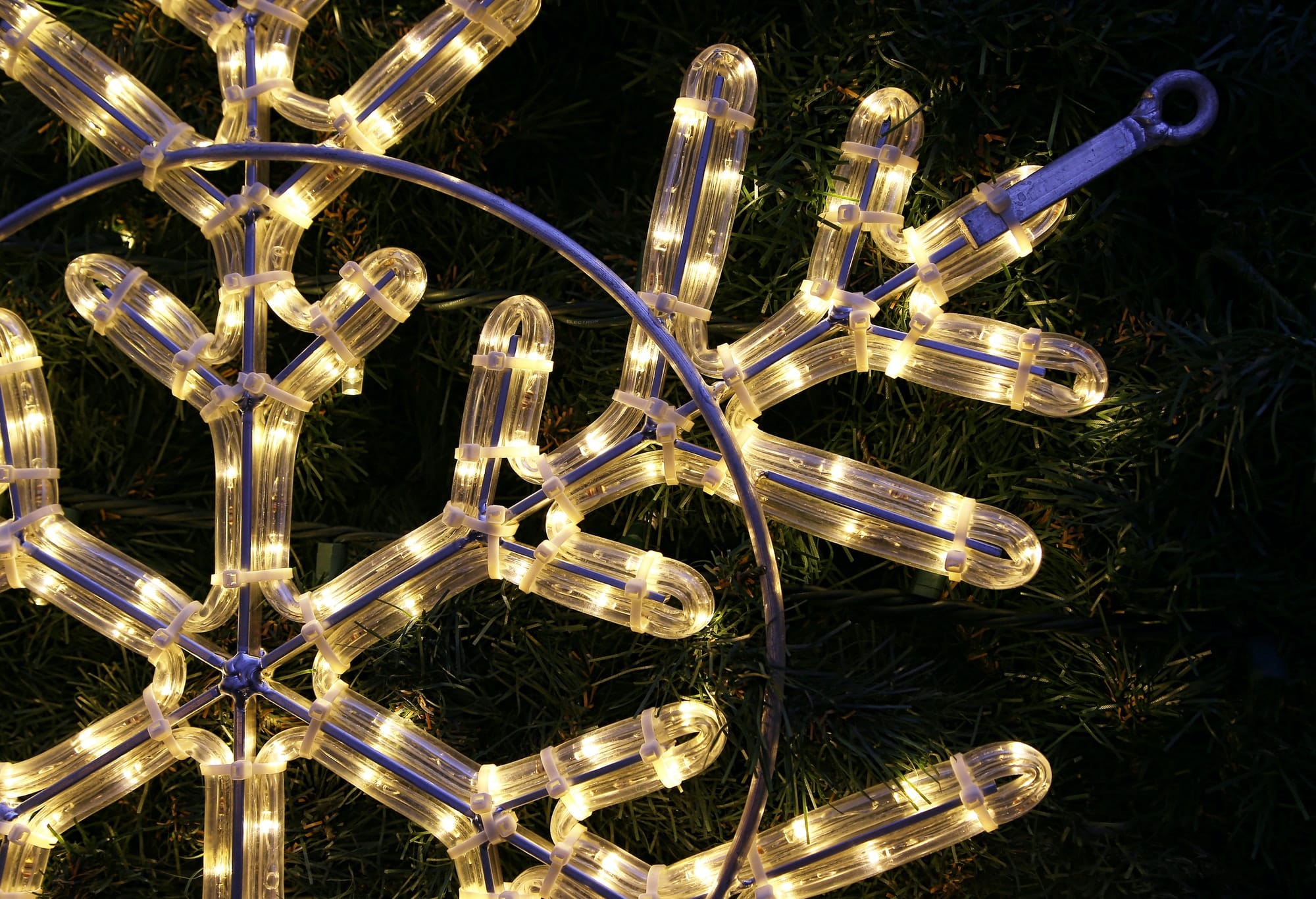 Close-up of bright glowing led christmas snowflake